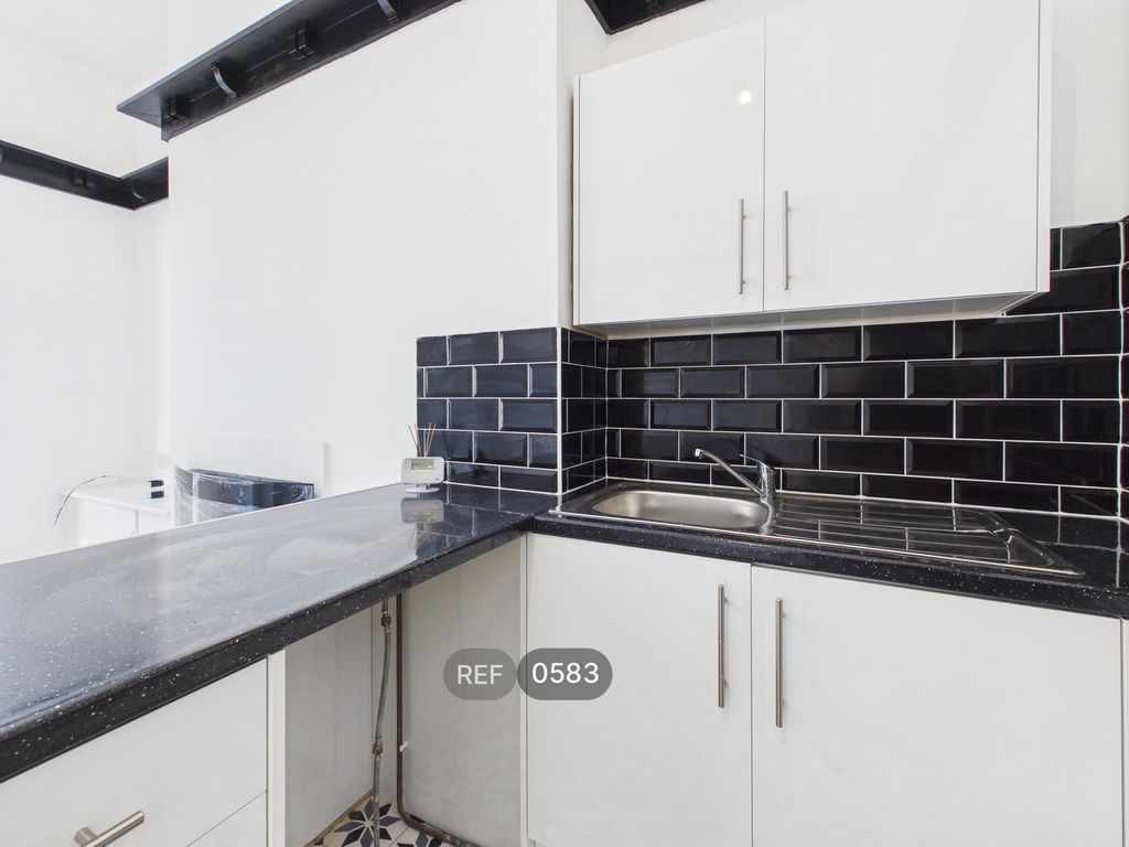 Property photo 3 of 17 Kitchen / Living Area