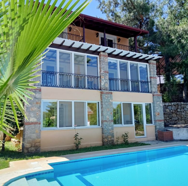Property photo 3 of 18 Sprawling Triplex Fethiye Villa For Sale In Ovacik - Pool With Steps For Easy Access