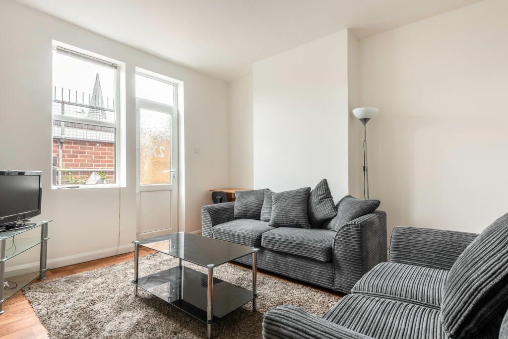 Property photo 3 of 11 Bright And Contemporary Living Room Featuring Comf...