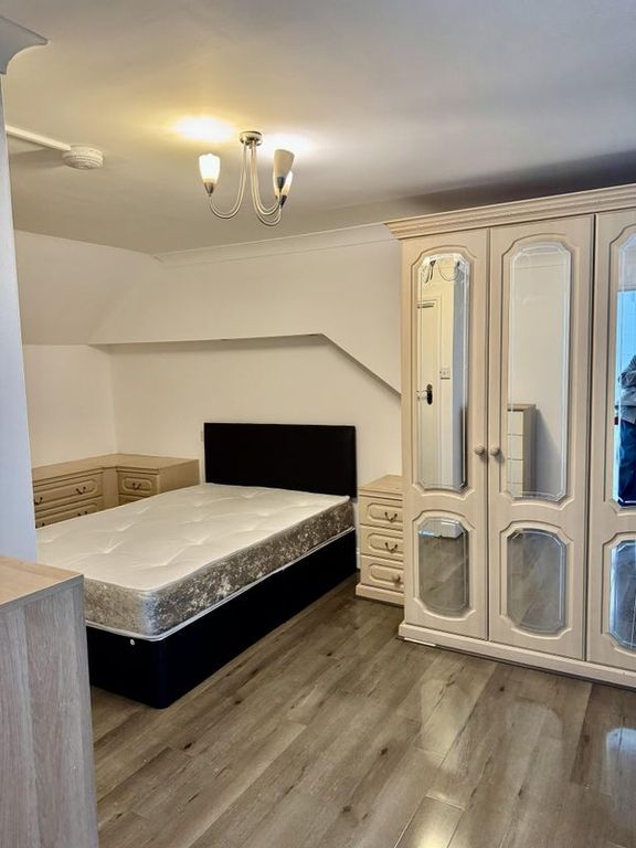 Property photo 1 of 5 Bright Bedroom With Ample Storage And Sleek Floor...