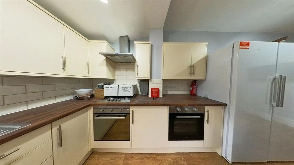 Property photo 2 of 12 Bright Modern Kitchen With White Cabinets, Wooden ...