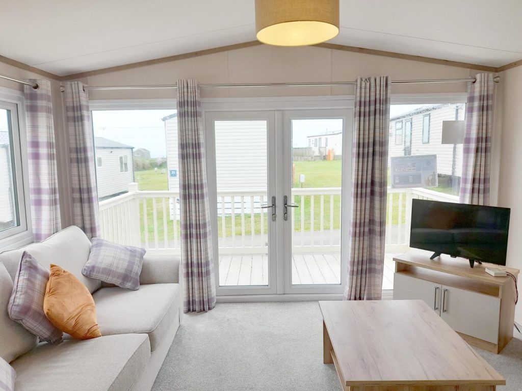 Property photo 2 of 14 Bright Lounge With French Doors Opening Onto The Decking