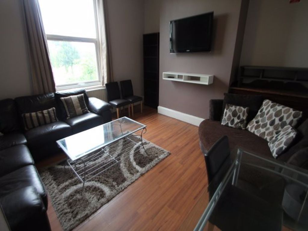 Property photo 3 of 22 A Comfortable Living Room Featuring A Large Window...