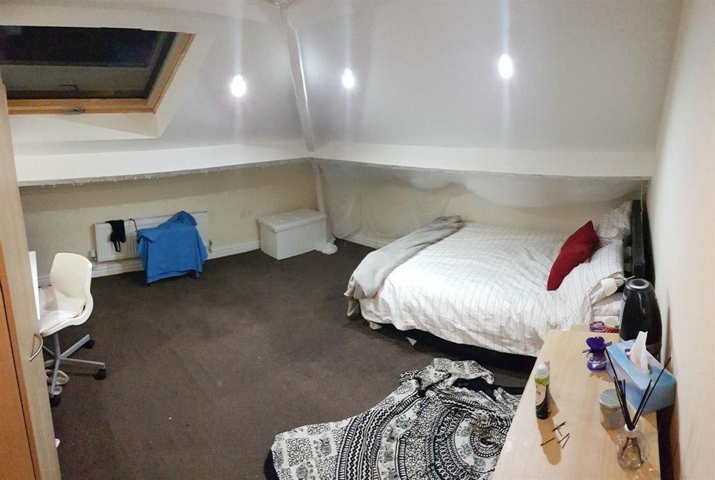 Property photo 3 of 15 Spacious Attic Bedroom Featuring A Comfy Double Be...
