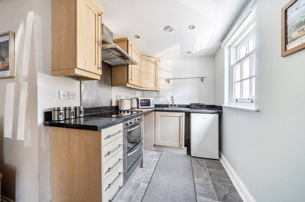 Property photo 3 of 12 Kitchen