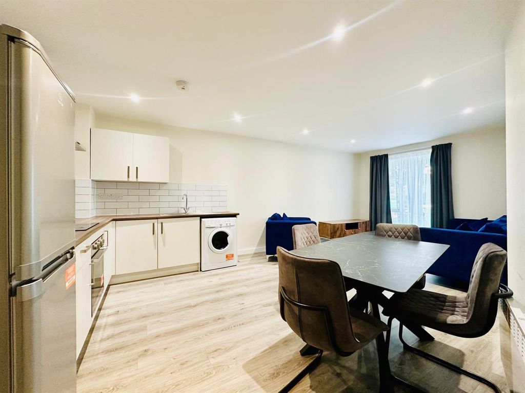 Property photo 3 of 11 Kitchen Living