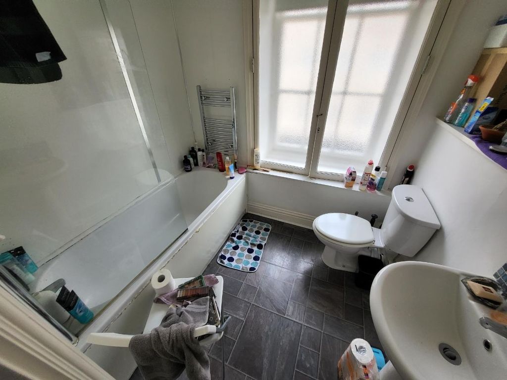 Property photo 3 of 3 Bright And Functional Bathroom Featuring A Bathtub...