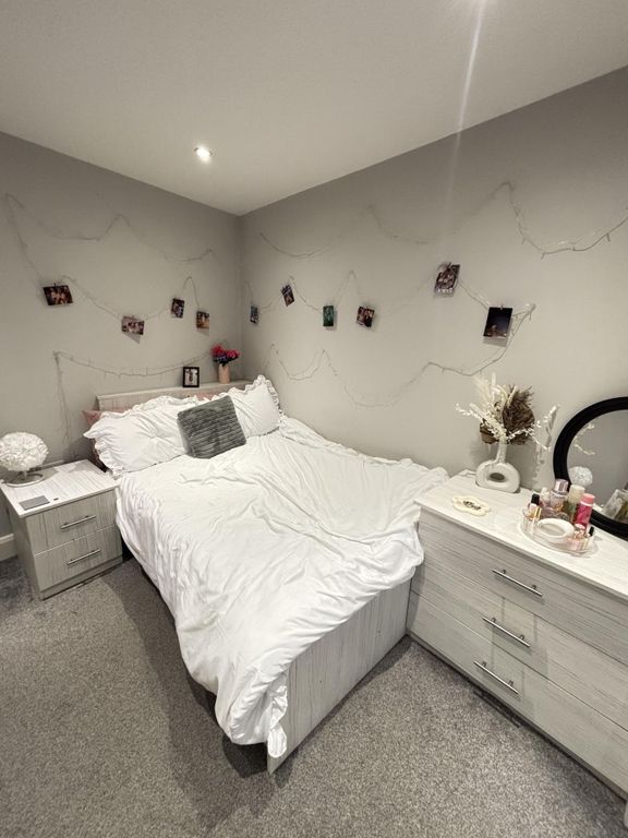 Property photo 1 of 17 A Spacious Master Bedroom Featuring A Comfortable ...