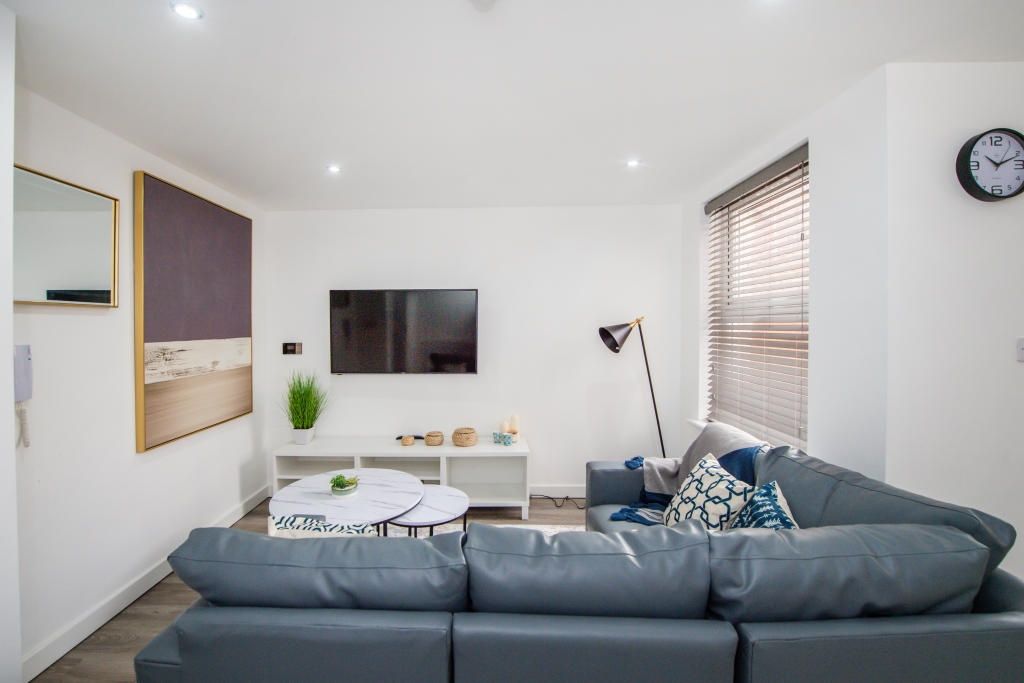 Property photo 3 of 13 A Modern, Well-Lit Living Room Featuring A Comfort...