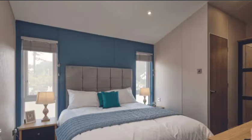 Property photo 3 of 4 Stylish Double Bedroom With Blue Featured Wall And Fitted Storage