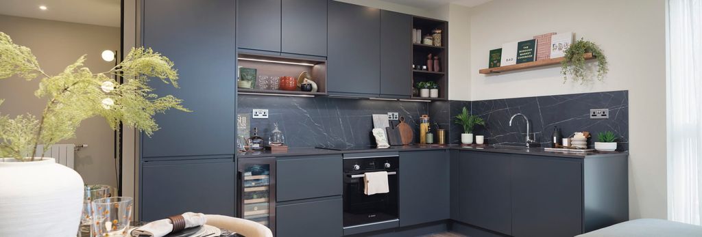 Property photo 2 of 5 Kitchen With Navy Blue Cupboard Panels And Splashback Tiles, Modern Appliances.