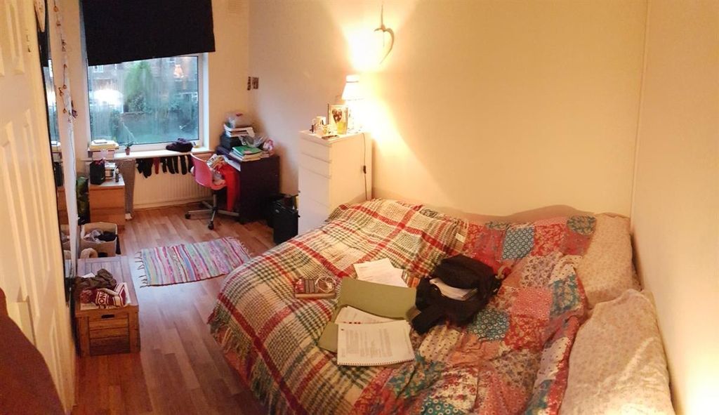 Property photo 2 of 9 A Cozy And Welcoming Living Room Featuring A Patte...