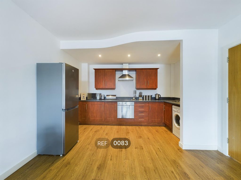 Property photo 3 of 7 Kitchen & Living Area