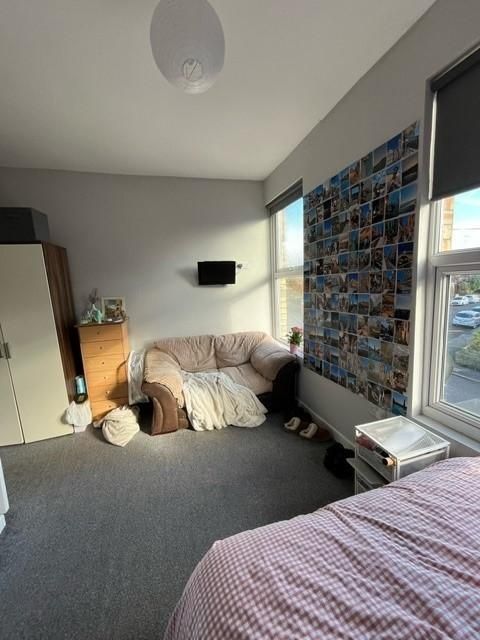 Property photo 1 of 14 Bright, Comfortable Bedroom Featuring A Cozy Sofa,...