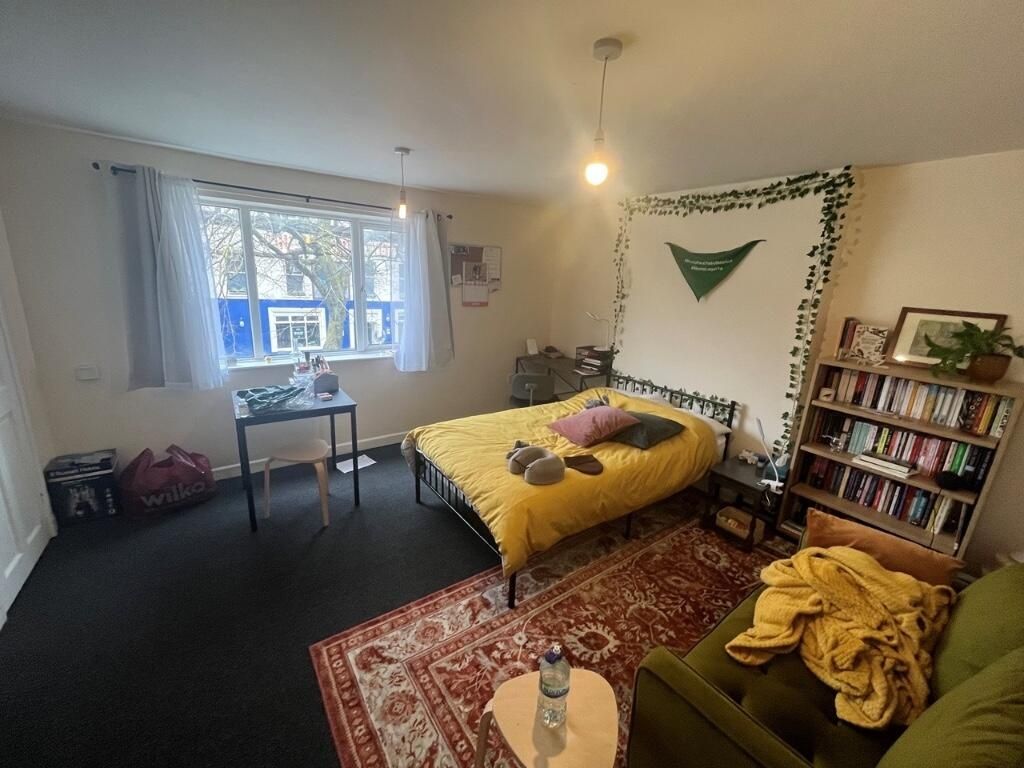 Property photo 2 of 8 Bright And Cozy Master Bedroom Featuring A Large W...