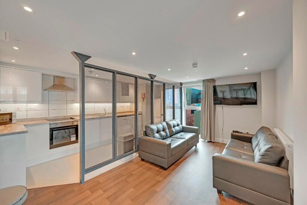 Property photo 3 of 15 A Modern And Inviting Living Room Featuring Comfor...