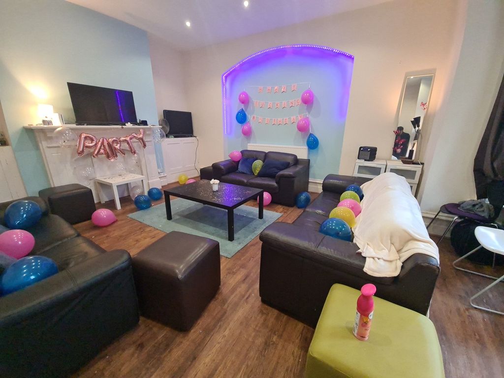 Property photo 3 of 29 Bright And Inviting Living Room Featuring Comforta...