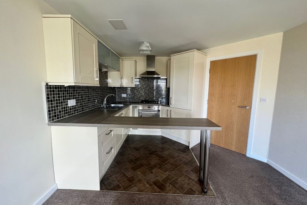 Property photo 3 of 12 Kitchen Area