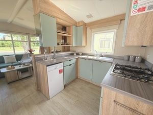 Property photo 2 of 5 Fully Equipped U Shaped Kitchen With Gas Hob And Storage