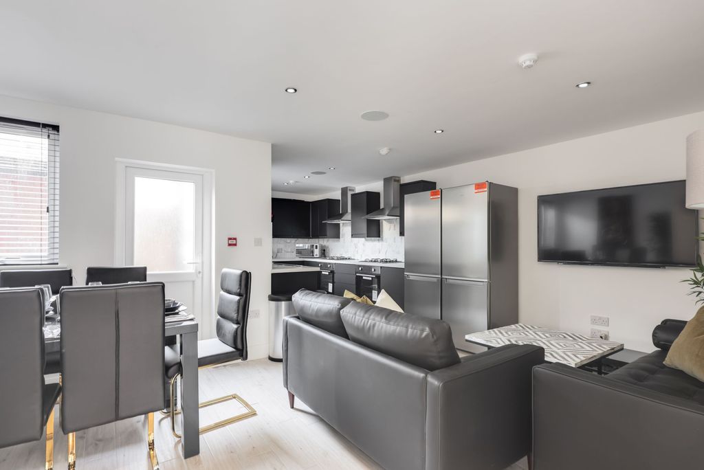 Property photo 1 of 11 Modern, Spacious Living Area Featuring Contemporar...