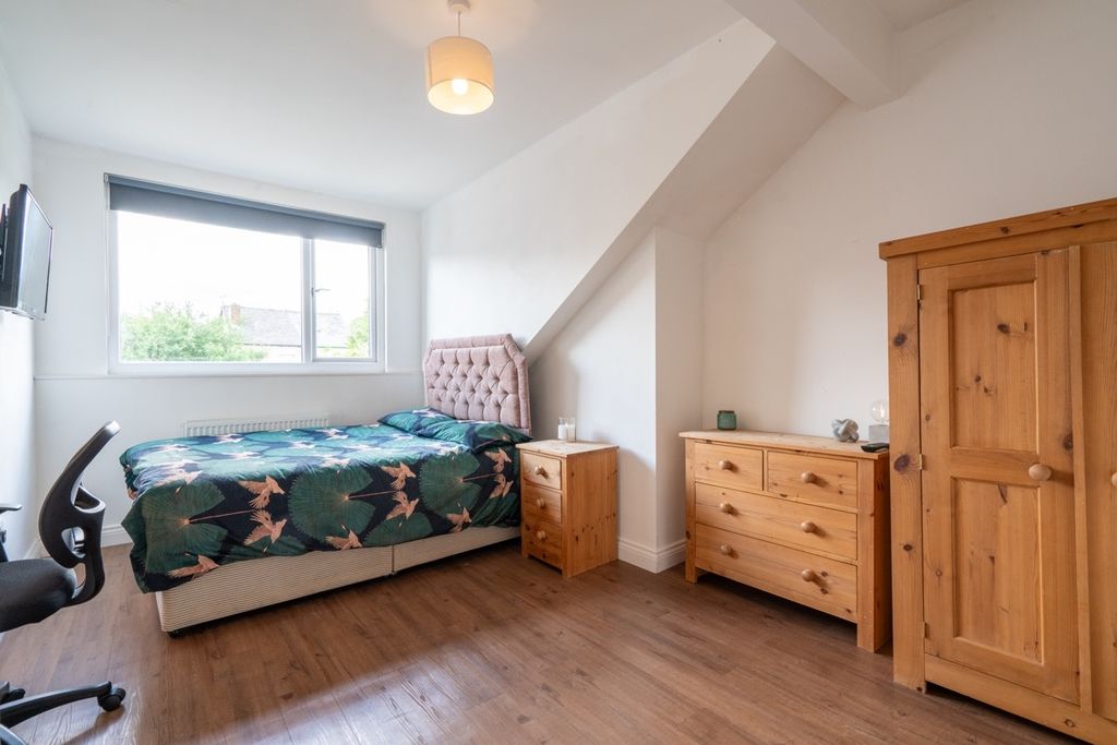 Property photo 3 of 12 Bright And Welcoming Bedroom Featuring A Comfortab...