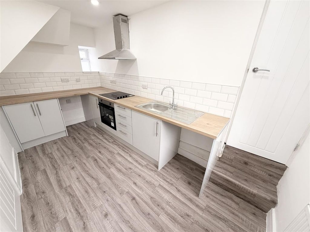 Property photo 1 of 13 Modern Kitchen With Sleek Wood-Effect Flooring...