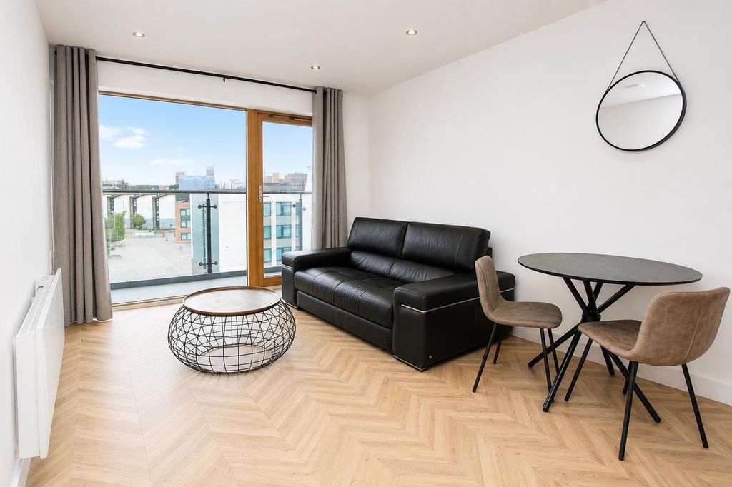 Property photo 1 of 8 Bright Living Room With Stylish Balcony Access...