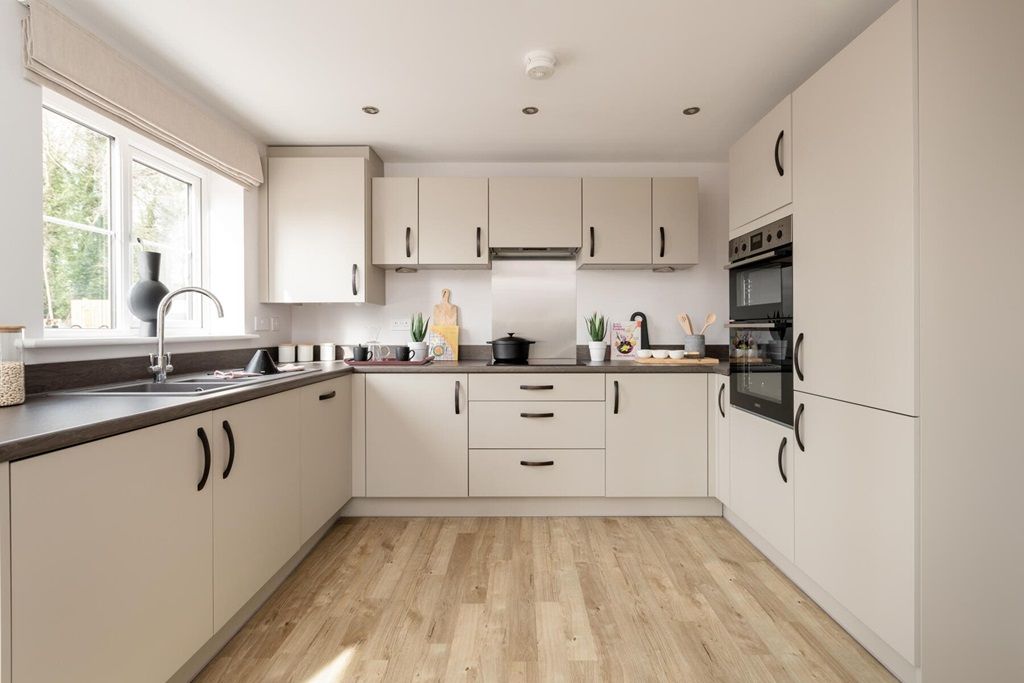 Property photo 3 of 14 Modern 3-Sided Kitchen With Ample Storage Space