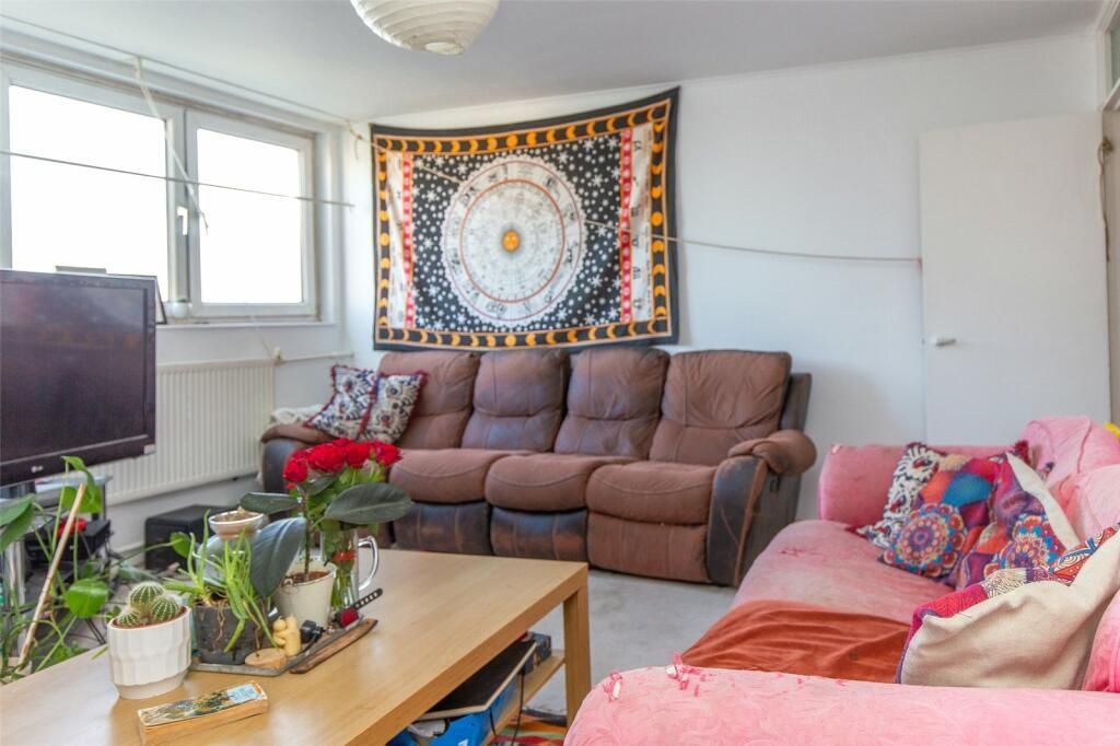 Property photo 3 of 7 Bright And Welcoming Living Room With Ample Natura...