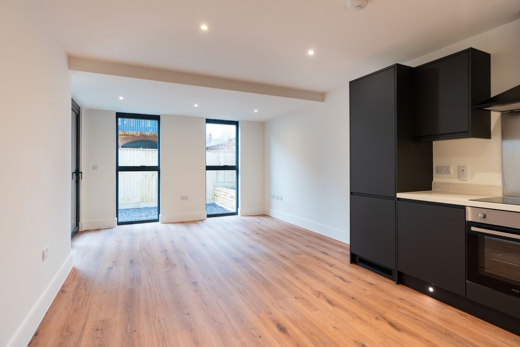 Property photo 2 of 12 Kitchen Living Area