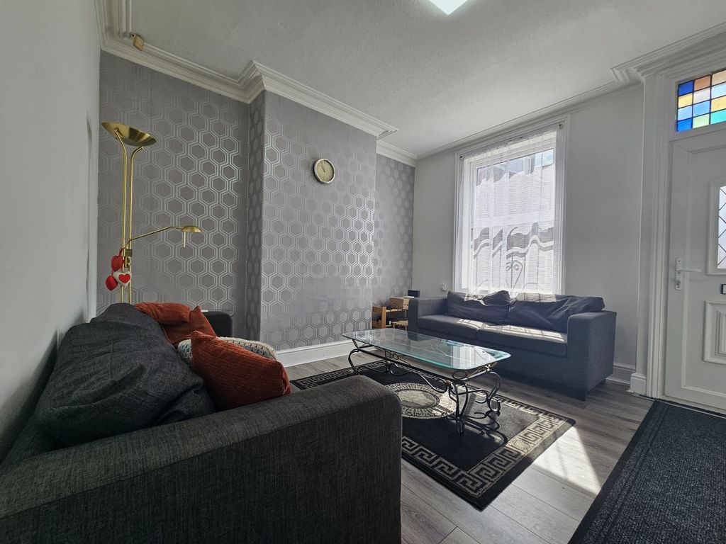 Property photo 2 of 18 A Spacious And Well-Maintained Living Room With Mo...