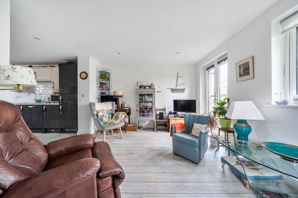Property photo 3 of 15 L-Shaped Living/Kitchen/Dining Space