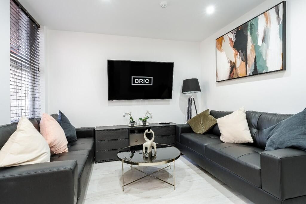 Property photo 1 of 15 A Stylish And Modern Living Room Featuring Plush S...