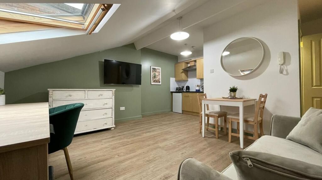 Property photo 2 of 7 A Spacious And Inviting Modern Living Room With Am...