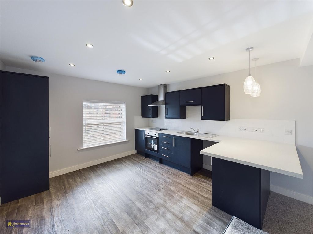 Property photo 1 of 9 Kitchen Area
