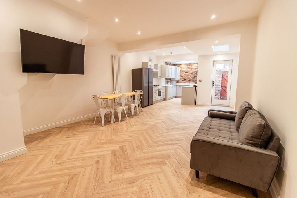 Property photo 1 of 20 Bright And Spacious Living Room Featuring A Large ...