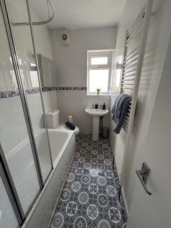 Property photo 1 of 9 This Charming Bathroom Features A Stylish Bathtub,...