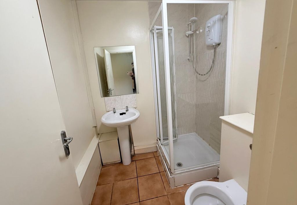 Property photo 2 of 15 A Compact Bathroom Featuring A Shower Enclosure, A...