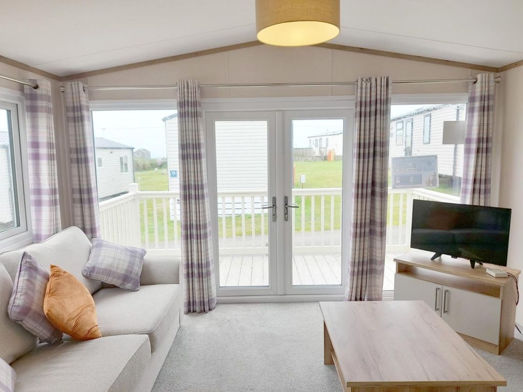Property photo 2 of 14 Bright Lounge With French Doors Opening Onto The Decking