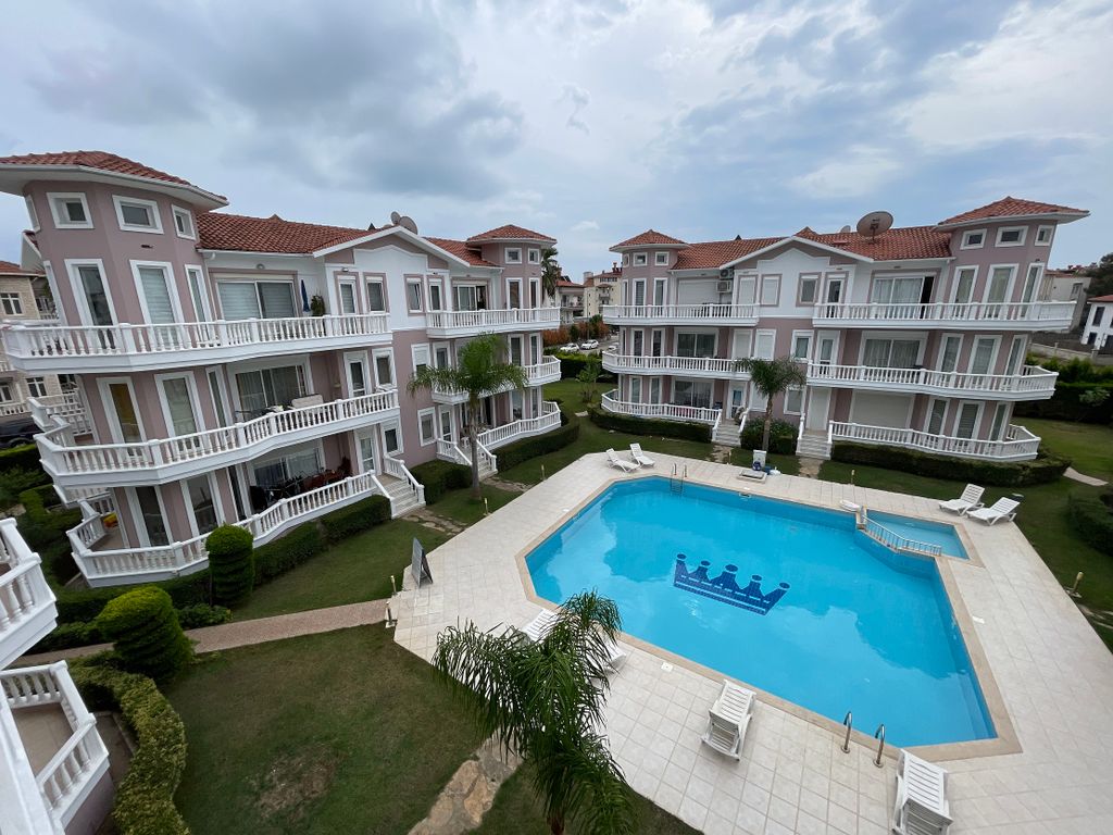 Property photo 2 of 17 A Charming Two-Bed Apartment In Belek For Sale - A Central Communal Pool And Terraces Surrounded By Gardens