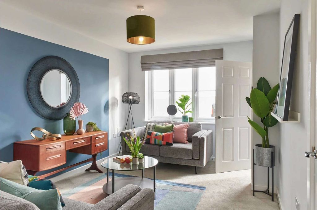 Property photo 3 of 6 A Cozy And Vibrant Living Room With A mix Of Modern And Vintage Elements
