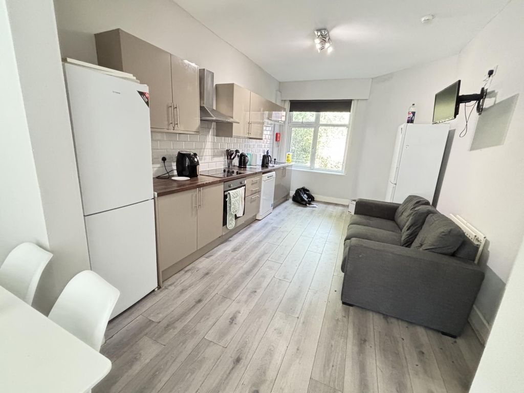 Property photo 3 of 11 A Bright And Modern Living Room Featuring A Comfor...