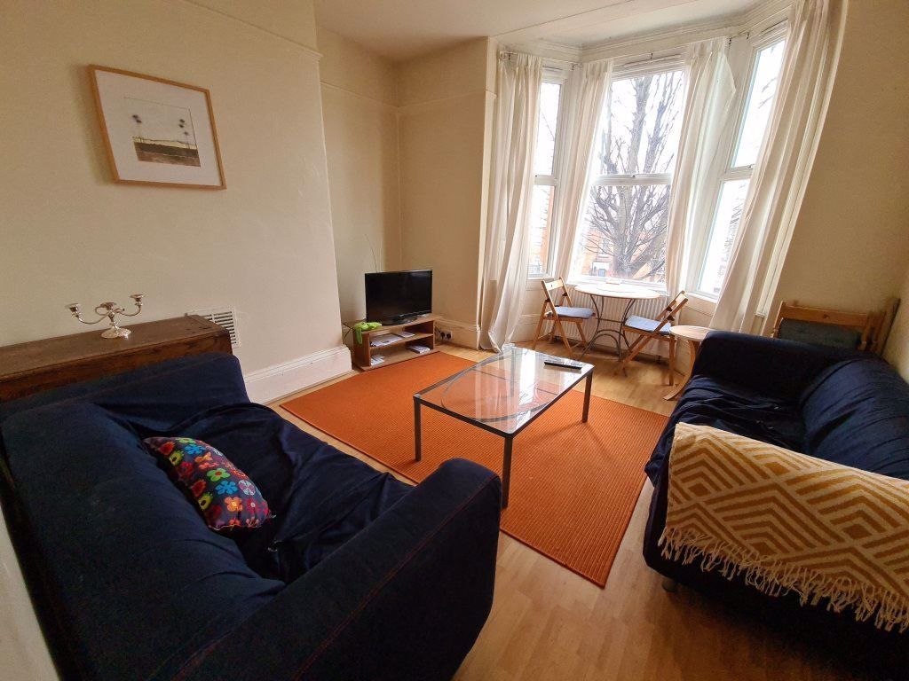 Property photo 2 of 9 A Welcoming Living Room Featuring Two Comfortable ...