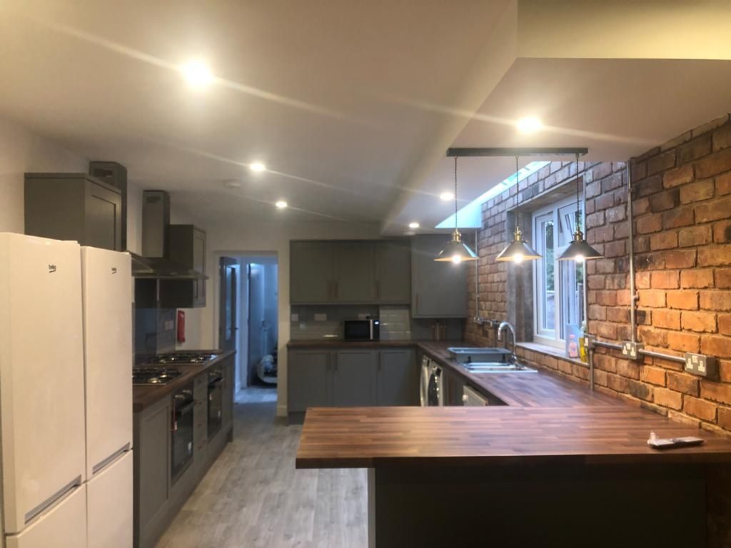 Property photo 1 of 7 Modern Fitted Kitchen With A Long Wooden Breakfast...
