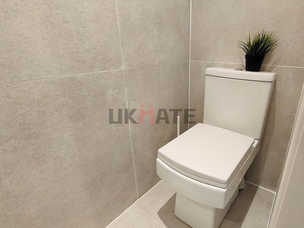 Property photo 1 of 7 A Clean, Modern Bathroom With Neutral Tiled Walls ...