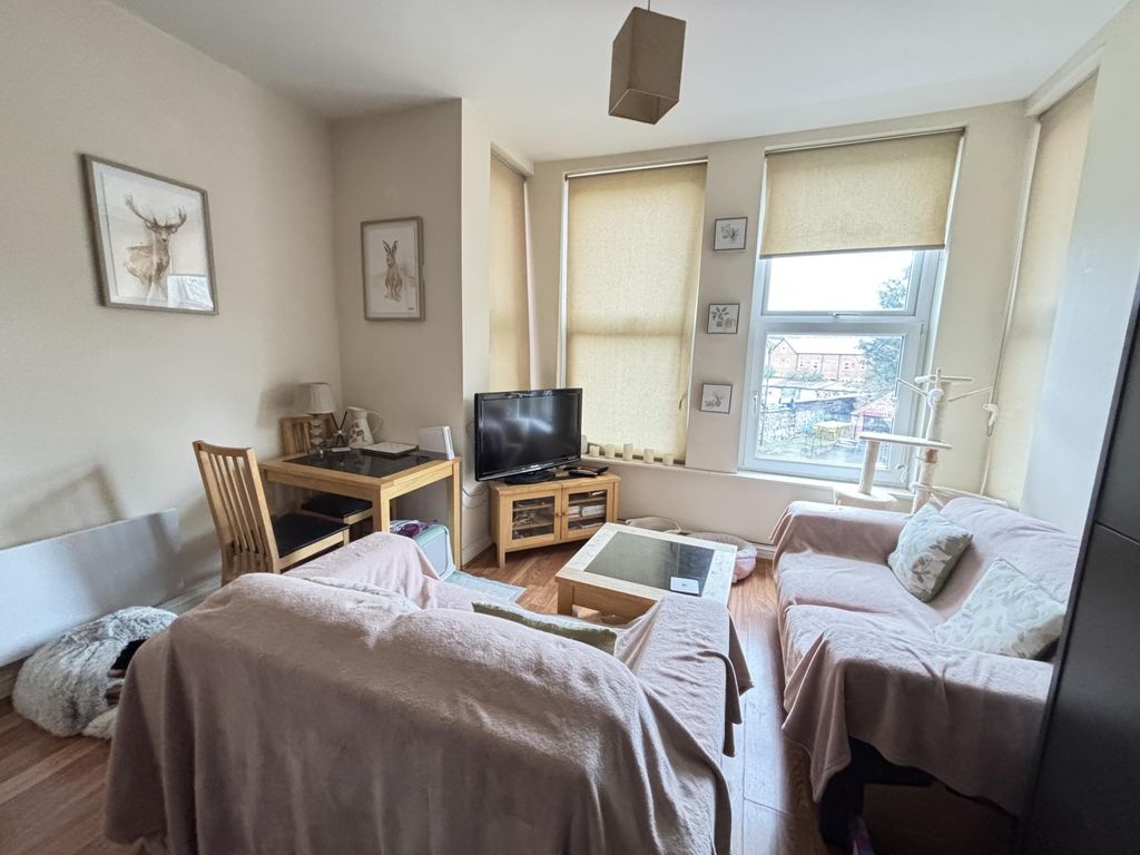 Property photo 3 of 12 Bright And Welcoming Living Room Filled With Natur...