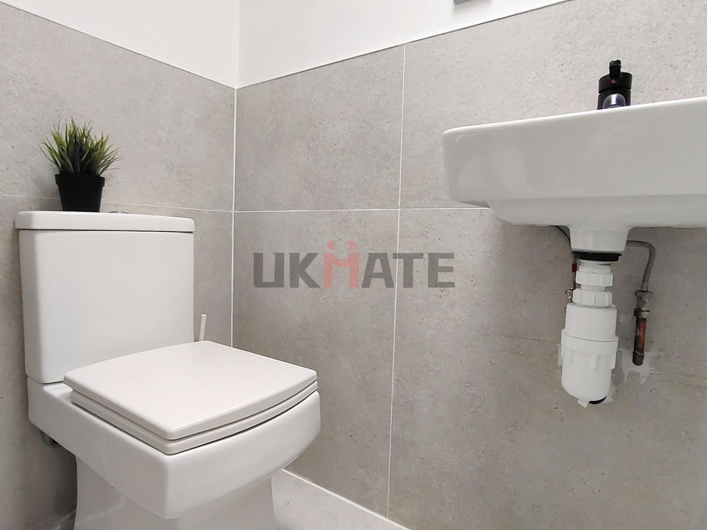 Property photo 2 of 5 A Clean And Modern Bathroom With A White Toilet An...