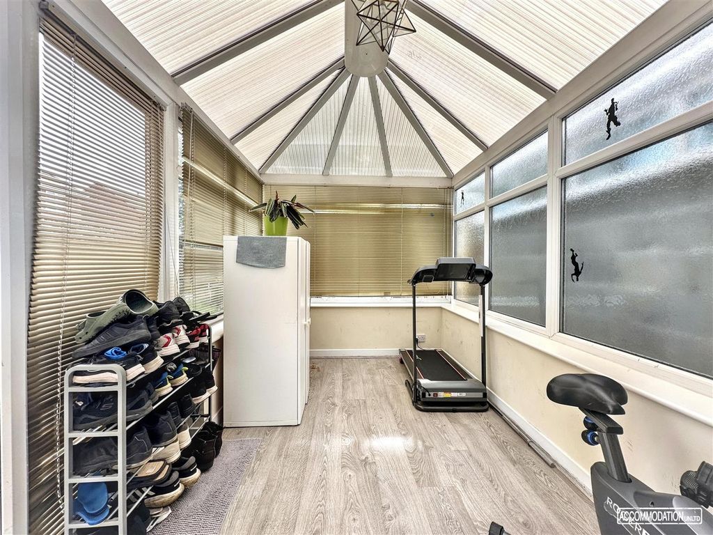Property photo 3 of 19 Bright Sunroom Equipped With Home Gym Machines...