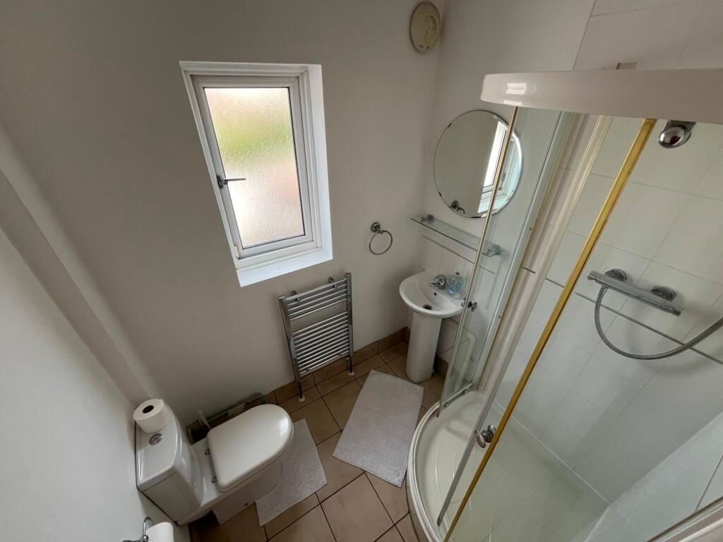 Property photo 2 of 8 Bright, Well-Maintained Bathroom With A Corner Sho...