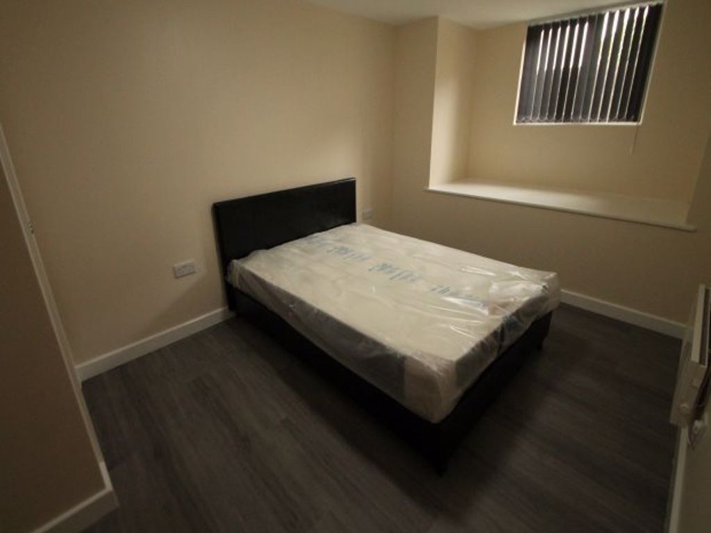 Property photo 2 of 3 A Cozy Bedroom Featuring A Double Bed With A Neutr...